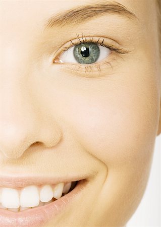 simsearch:695-03388489,k - Woman's smiling face, extreme close-up Stock Photo - Premium Royalty-Free, Code: 632-01153420