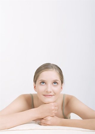 simsearch:695-05777385,k - Woman resting head on hands, looking up Stock Photo - Premium Royalty-Free, Code: 632-01153509