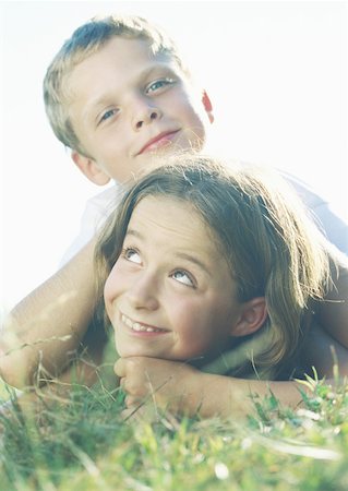 Boy and girl lying in grass Stock Photo - Premium Royalty-Free, Code: 632-01153645