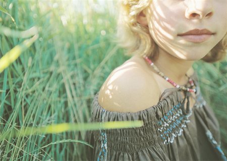 preteen beautiful face - Girl sitting in grass Stock Photo - Premium Royalty-Free, Code: 632-01153677