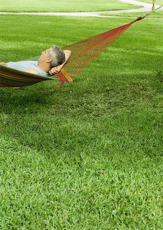 Man resting in hammock Stock Photo - Premium Royalty-Free, Code: 632-01161461