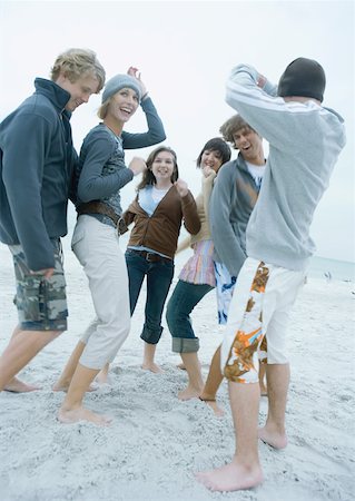 Group of young adult friends dancing on beach Stock Photo - Premium Royalty-Free, Code: 632-01161510