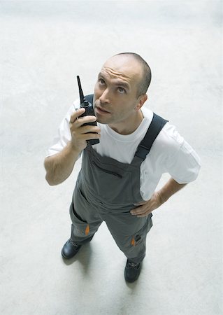 simsearch:632-01157373,k - Factory worker using walkie talkie Fotografie stock - Premium Royalty-Free, Codice: 632-01162303