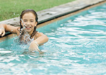 Little girl in swimming pool, splashing Stock Photo - Premium Royalty-Free, Code: 632-01193758