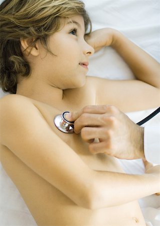 doctor listening boy - Boy being examined by doctor with stethoscope Stock Photo - Premium Royalty-Free, Code: 632-01193879