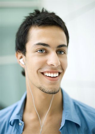 Teen boy listening to earphones Stock Photo - Premium Royalty-Free, Code: 632-01193986