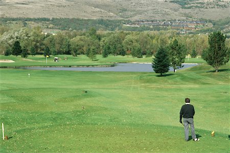 pond top view - Man standing on golf course Stock Photo - Premium Royalty-Free, Code: 632-01234614