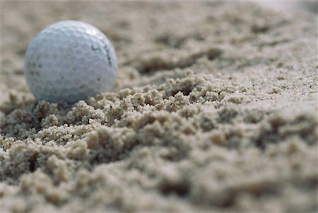 Golf ball in sand, close-up Stock Photo - Premium Royalty-Free, Code: 632-01234690