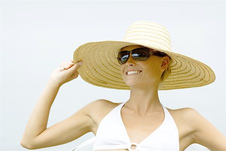 swim suit white background sitting - Young woman wearing sunglasses and sunhat, head and shoulders Stock Photo - Premium Royalty-Free, Code: 632-01278062