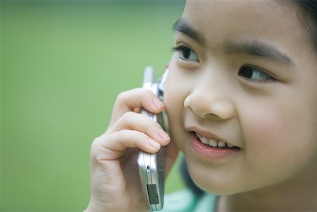 simsearch:632-01271089,k - Little girl using cell phone, close-up Stock Photo - Premium Royalty-Free, Code: 632-01271067