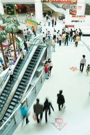 people walking in the distance - Escalators in shopping mall Stock Photo - Premium Royalty-Free, Code: 632-01271306