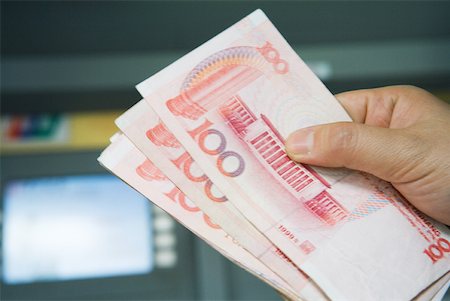 renminbi - Hand holding 100 Yuan bills Stock Photo - Premium Royalty-Free, Code: 632-01271300