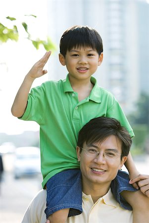 simsearch:696-03401226,k - Man carrying son on shoulders, boy making gesture Stock Photo - Premium Royalty-Free, Code: 632-01271751