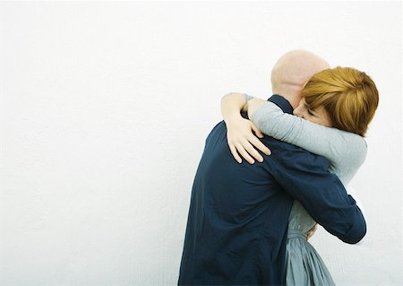 Young couple embracing, side view Stock Photo - Premium Royalty-Free, Code: 632-01271955