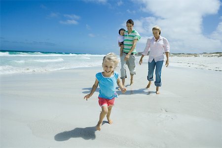 running forward - Family on beach Stock Photo - Premium Royalty-Free, Code: 632-01380016