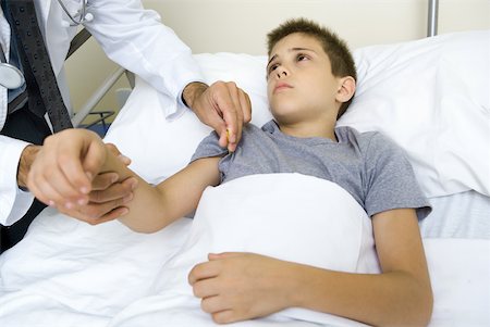 Doctor taking boy's temperature Stock Photo - Premium Royalty-Free, Code: 632-01380261