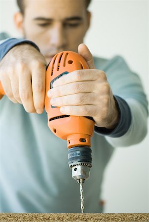 Man using drill Foto de stock - Sin royalties Premium, Código: 632-01380510