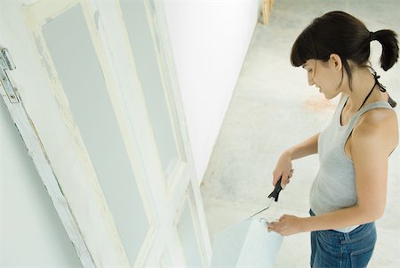 Woman painting door Stock Photo - Premium Royalty-Free, Code: 632-01380533