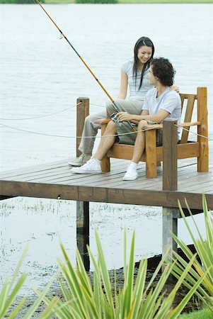 Couple fishing on pier Stock Photo - Premium Royalty-Free, Code: 632-01380570