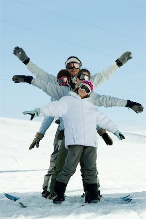 four shapes - Young skiers with arms out, full length portrait Foto de stock - Sin royalties Premium, Código: 632-01380759