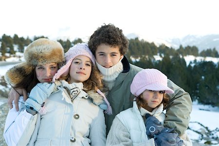 simsearch:696-03401679,k - Four young siblings standing in snowy landscape, portrait Stock Photo - Premium Royalty-Free, Code: 632-01380777