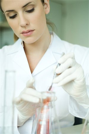 slide (microscope slide) - Young woman working in scientific laboratory Stock Photo - Premium Royalty-Free, Code: 632-01612781