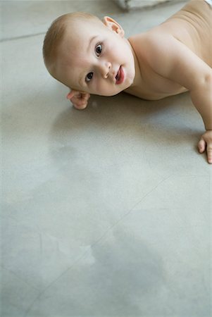 simsearch:632-01636989,k - Baby on floor, looking up at camera Stock Photo - Premium Royalty-Free, Code: 632-01636914