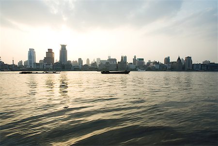 eddie - China, Guangdong Province, Guangzhou, view of high rises from river Stock Photo - Premium Royalty-Free, Code: 632-01637934