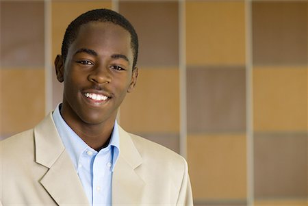 Young male dressed in business attire smiling at camera, portrait Stock Photo - Premium Royalty-Free, Code: 632-01638484