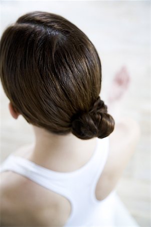 Brunette woman wearing hair in chignon, rear view Stock Photo - Premium Royalty-Free, Code: 632-01638621