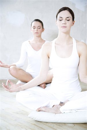 simsearch:632-03651843,k - Two young women sitting in lotus position, eyes closed Stock Photo - Premium Royalty-Free, Code: 632-01638632