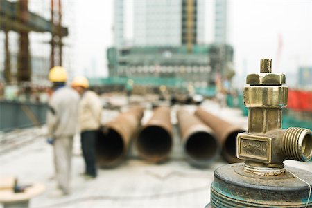 simsearch:632-01784605,k - Construction site, focus on spigot in foreground Stock Photo - Premium Royalty-Free, Code: 632-01784581