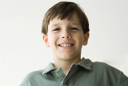 polo shirt silhouette - Boy smiling at camera, portrait Stock Photo - Premium Royalty-Free, Code: 632-01828368