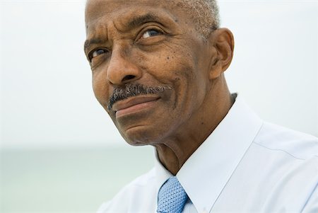 simsearch:696-03401990,k - Senior man looking up, smiling, cropped portrait Stock Photo - Premium Royalty-Free, Code: 632-01828371
