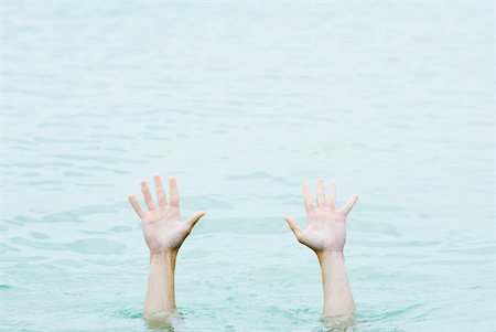 struggle to reach - Hands rising out of water, cropped view Stock Photo - Premium Royalty-Free, Code: 632-01828449