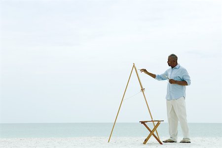 painter (artwork) - Senior man painting canvas at the beach, side view Stock Photo - Premium Royalty-Free, Code: 632-01828493