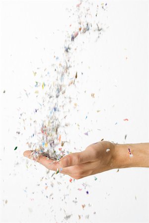 simsearch:632-03779312,k - Hand catching falling confetti Stock Photo - Premium Royalty-Free, Code: 632-02128109