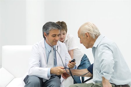 simsearch:696-03401990,k - Doctor measuring senior man's blood pressure, boy watching Stock Photo - Premium Royalty-Free, Code: 632-02227632