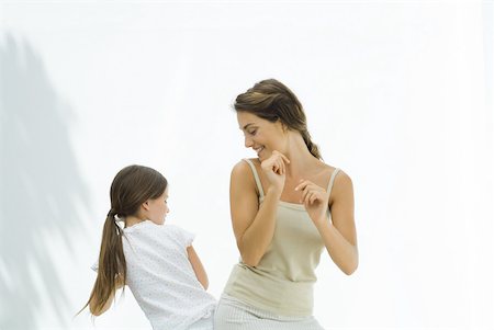 silhouette and mother - Mother dancing with daughter, bumping hips together Stock Photo - Premium Royalty-Free, Code: 632-02227927