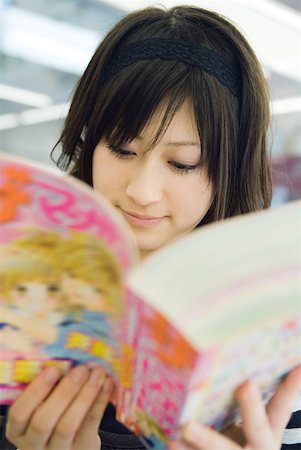simsearch:632-03027019,k - Young Japanese woman reading manga-style comic book Stock Photo - Premium Royalty-Free, Code: 632-02344446