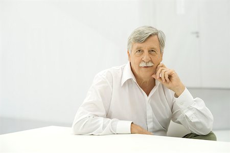 plain background - Senior man looking at camera, portrait Stock Photo - Premium Royalty-Free, Code: 632-02344965