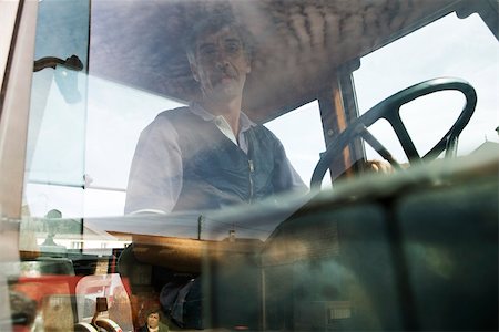 driver (car, male) - France, Champagne-Ardenne, Aube, farmer sitting in tractor, portrait Stock Photo - Premium Royalty-Free, Code: 632-02690342