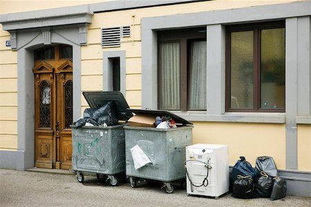 shopping appliance not electronics not grocery not clothes - Overflowing trash bins in front of building Stock Photo - Premium Royalty-Free, Code: 632-02690397