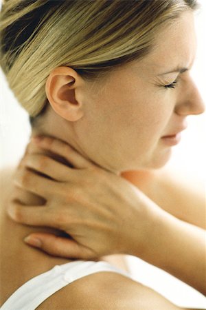 Woman holding neck, eyes closed Stock Photo - Premium Royalty-Free, Code: 632-02744695