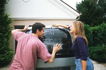 Couple washing car together Stock Photo - Premium Royalty-Free, Code: 632-02744803