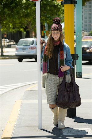 Young woman in trendy clothing standing on sidewalk, full length portrait Stock Photo - Premium Royalty-Free, Code: 632-02744999