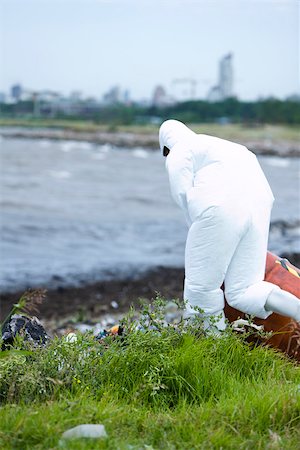 simsearch:632-02745049,k - Person in protective suit cleaning up polluted shore Stock Photo - Premium Royalty-Free, Code: 632-02745067