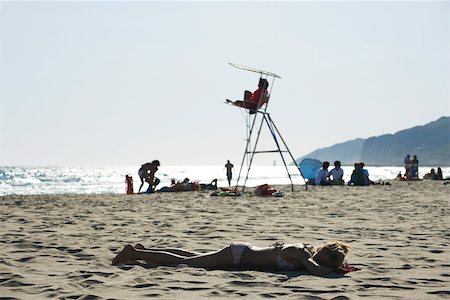 female lifeguard - Teen girl sunbathing on beach Stock Photo - Premium Royalty-Free, Code: 632-02745247