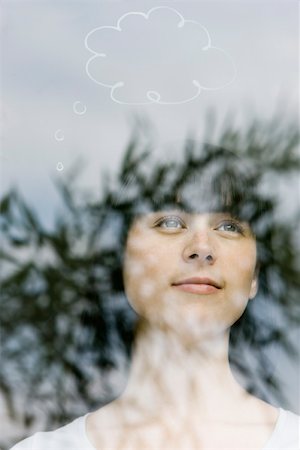 Young woman with thought bubble over head Stock Photo - Premium Royalty-Free, Code: 632-02745334