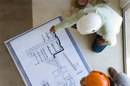 projection presentation - Two men reviewing blueprint spread out on floor Stock Photo - Premium Royalty-Free, Code: 632-02885317